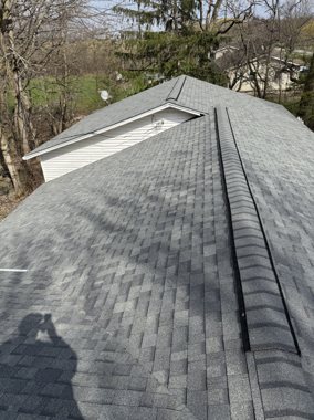 Fresh architectural shingles, blue sky — TNE Roofing & Siding